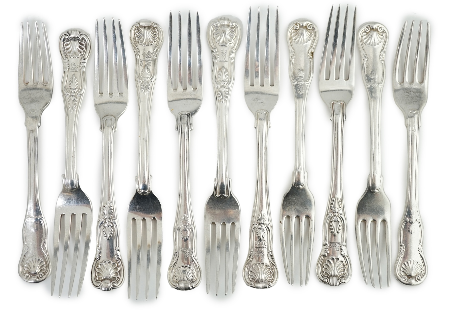 A harlequin set of eleven Georgian and Victorian silver Kings pattern dessert forks, various dates and makers